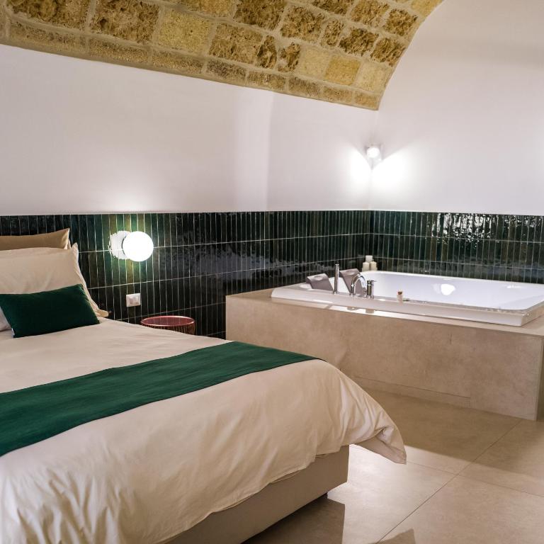 Postel nebo postele na pokoji v ubytování Casa Minerva - Suite e Relax