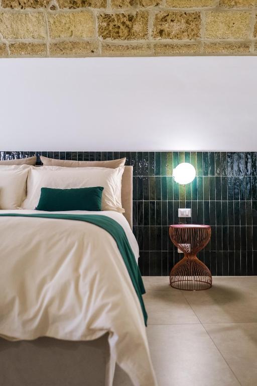 Postel nebo postele na pokoji v ubytování Casa Minerva - Suite e Relax