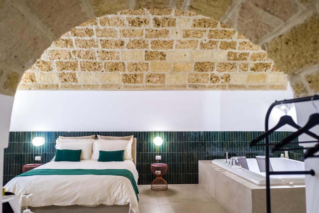 Postel nebo postele na pokoji v ubytování Casa Minerva - Suite e Relax
