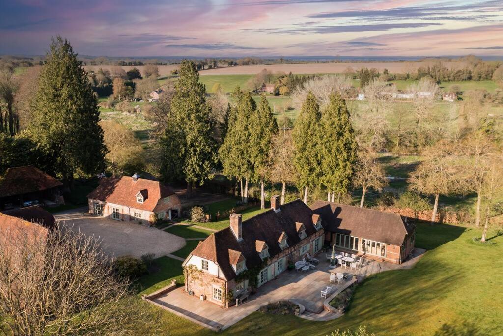 an aerial view of a large house in a field at The Old Stables, Derrydown Farm in Andover