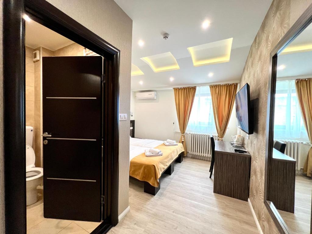 Postel nebo postele na pokoji v ubytování Side One Design Hotel Garni
