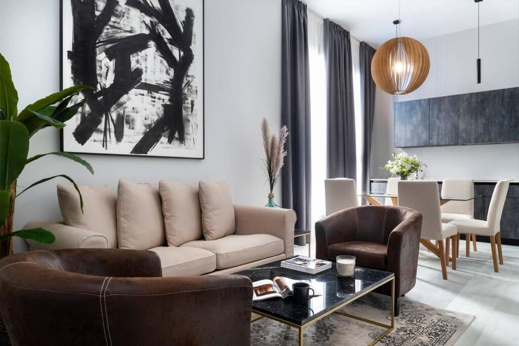 a living room with a couch and chairs and a table at San Buenaventura Apartment 13 in Seville