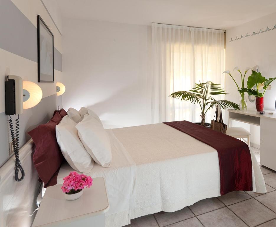 Postel nebo postele na pokoji v ubytování Hotel Gabriella