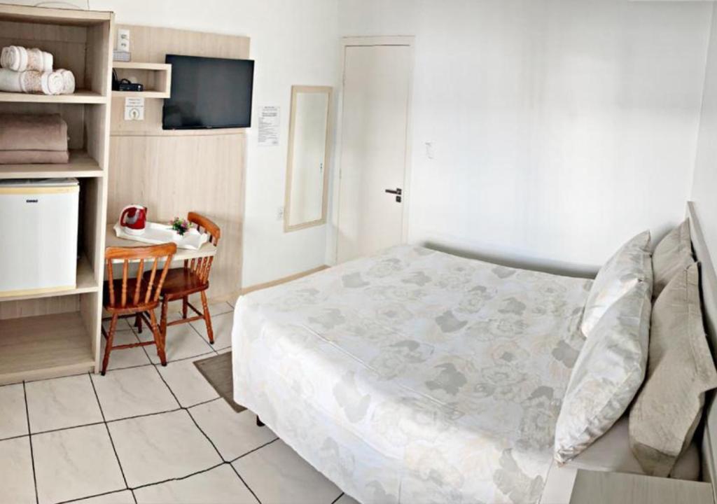 Cama ou camas em um quarto em Pousada Enseada dos Golfinhos