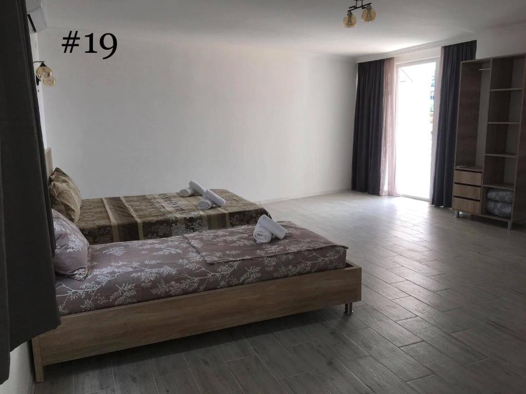 Postel nebo postele na pokoji v ubytování Rezo's House