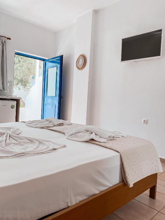 Postel nebo postele na pokoji v ubytování Lindos Athena