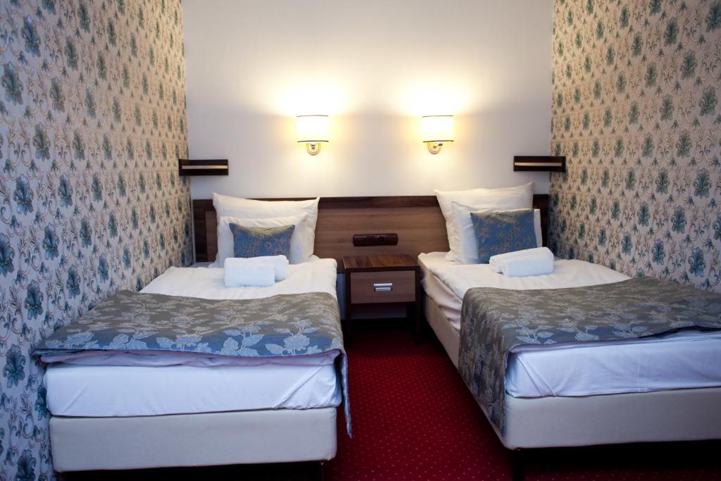 Postel nebo postele na pokoji v ubytování Hotel Politański