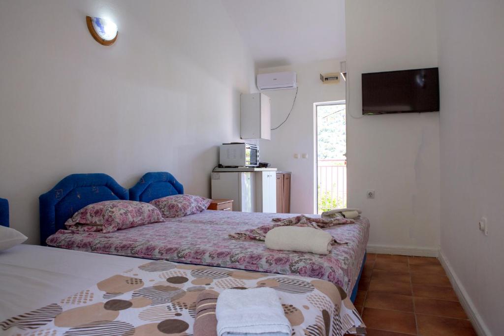 Postel nebo postele na pokoji v ubytování Family Apartments Vukcevic