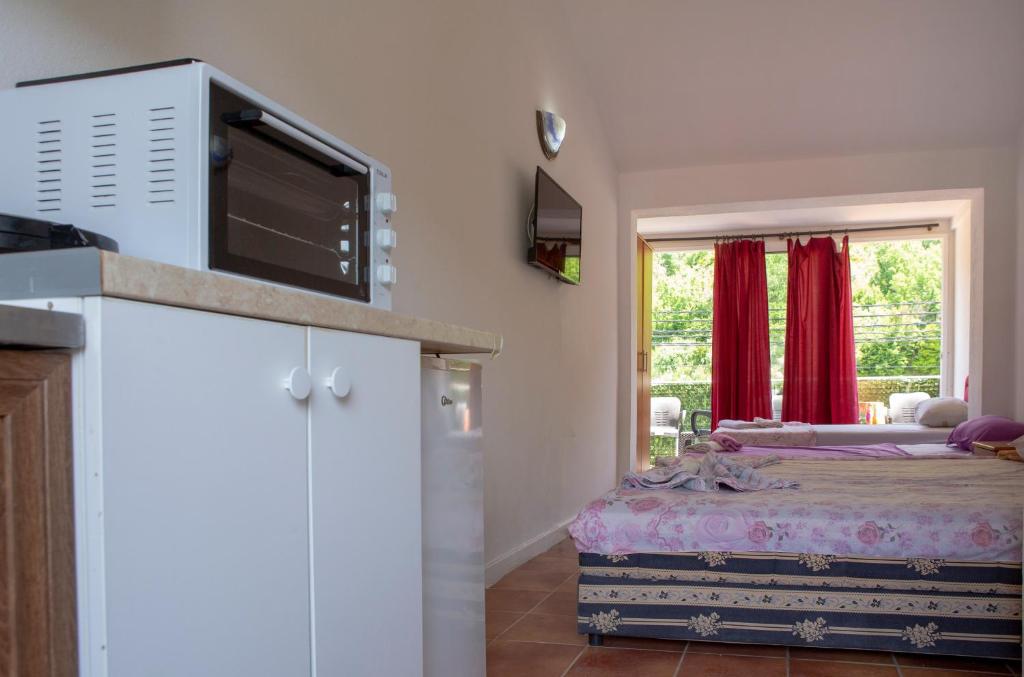 Postel nebo postele na pokoji v ubytování Family Apartments Vukcevic