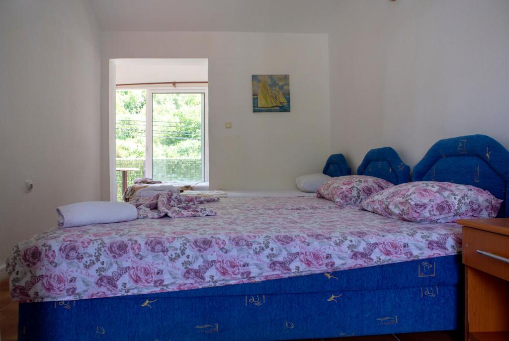 Postel nebo postele na pokoji v ubytování Family Apartments Vukcevic
