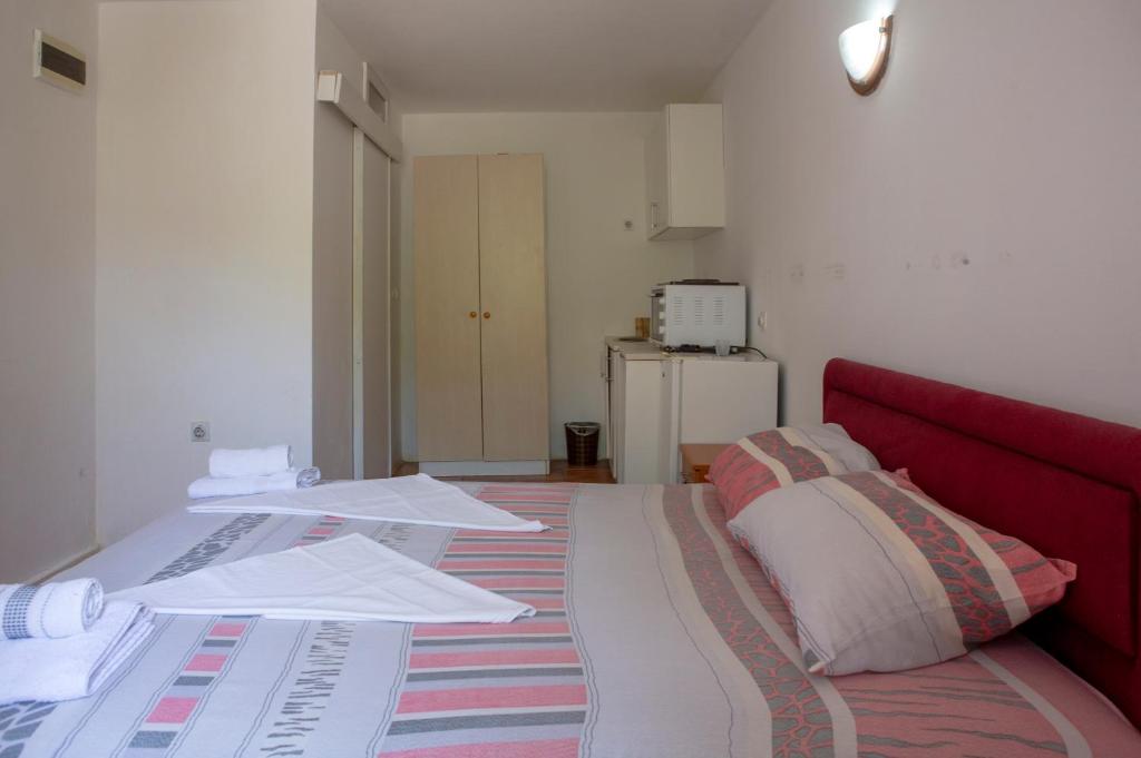 Postel nebo postele na pokoji v ubytování Family Apartments Vukcevic