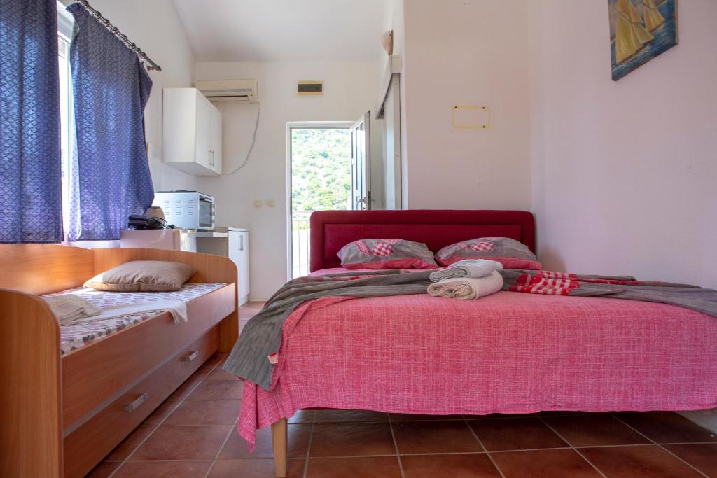 Postel nebo postele na pokoji v ubytování Family Apartments Vukcevic