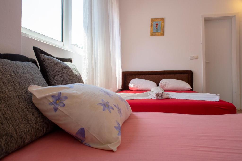 Postel nebo postele na pokoji v ubytování Family Apartments Vukcevic