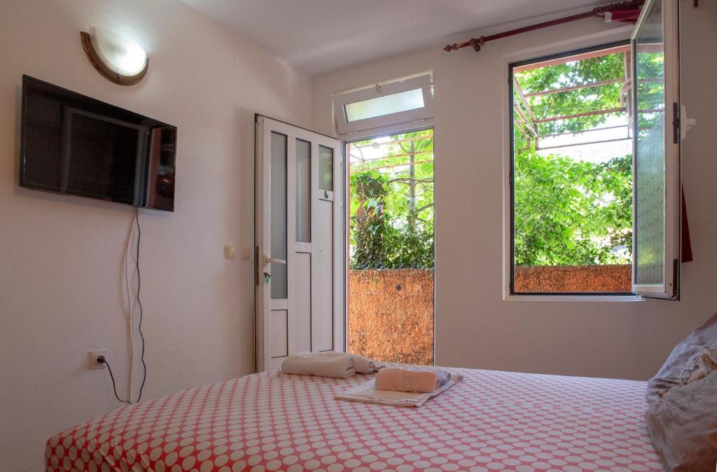 Postel nebo postele na pokoji v ubytování Family Apartments Vukcevic