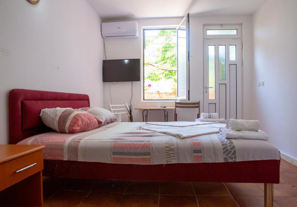 Postel nebo postele na pokoji v ubytování Family Apartments Vukcevic