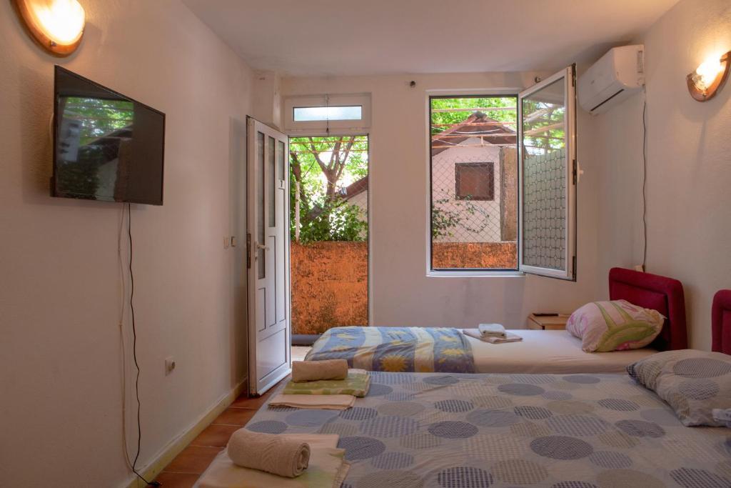 Postel nebo postele na pokoji v ubytování Family Apartments Vukcevic