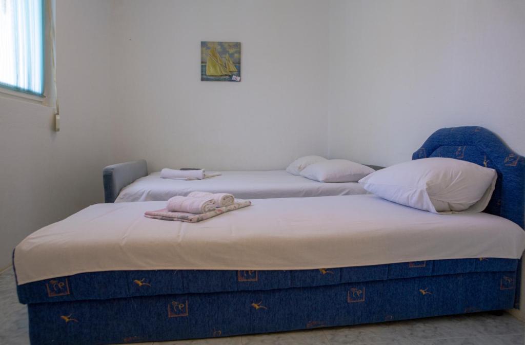 Postel nebo postele na pokoji v ubytování Family Apartments Vukcevic