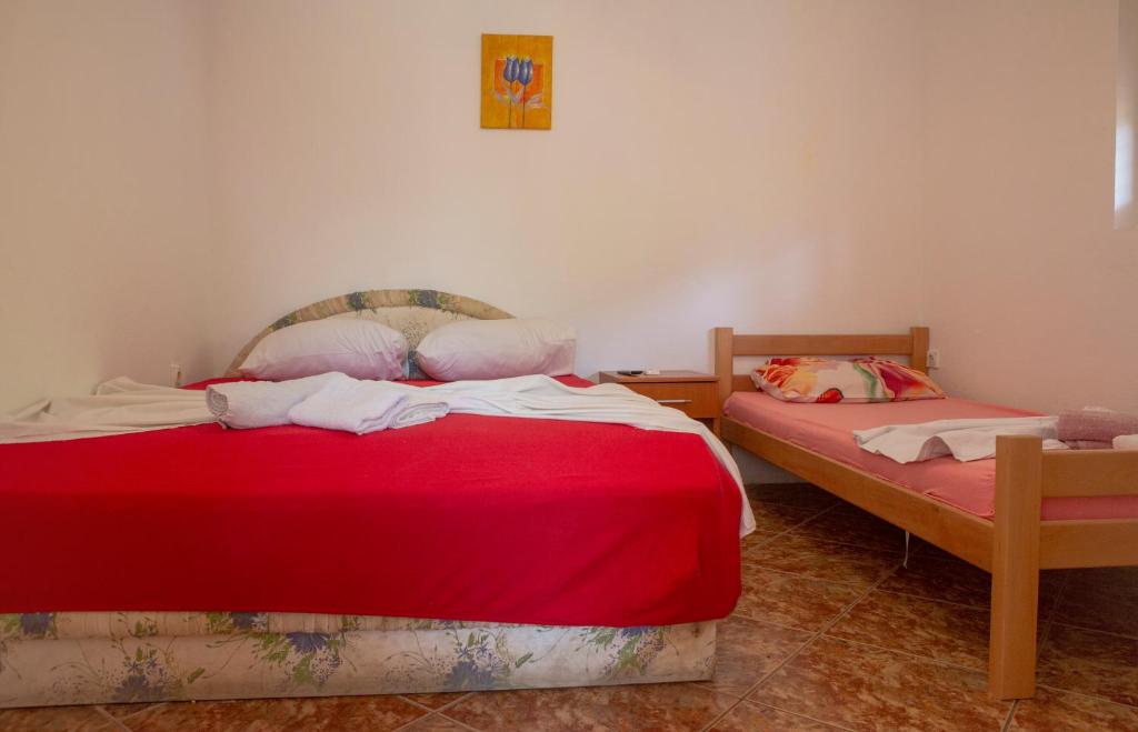Postel nebo postele na pokoji v ubytování Family Apartments Vukcevic