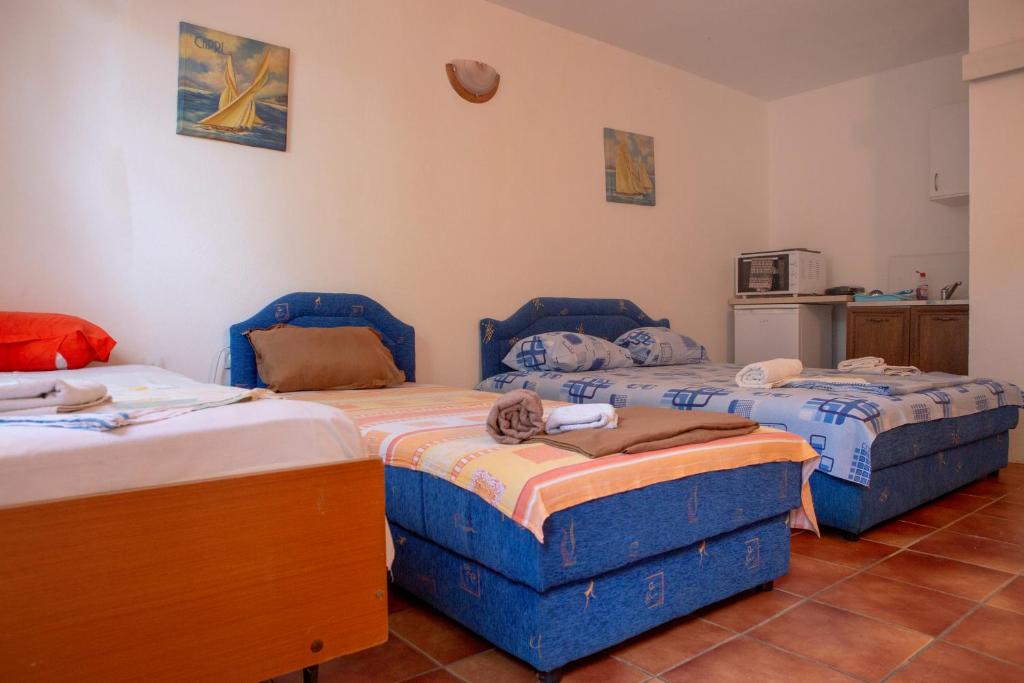 Postel nebo postele na pokoji v ubytování Family Apartments Vukcevic