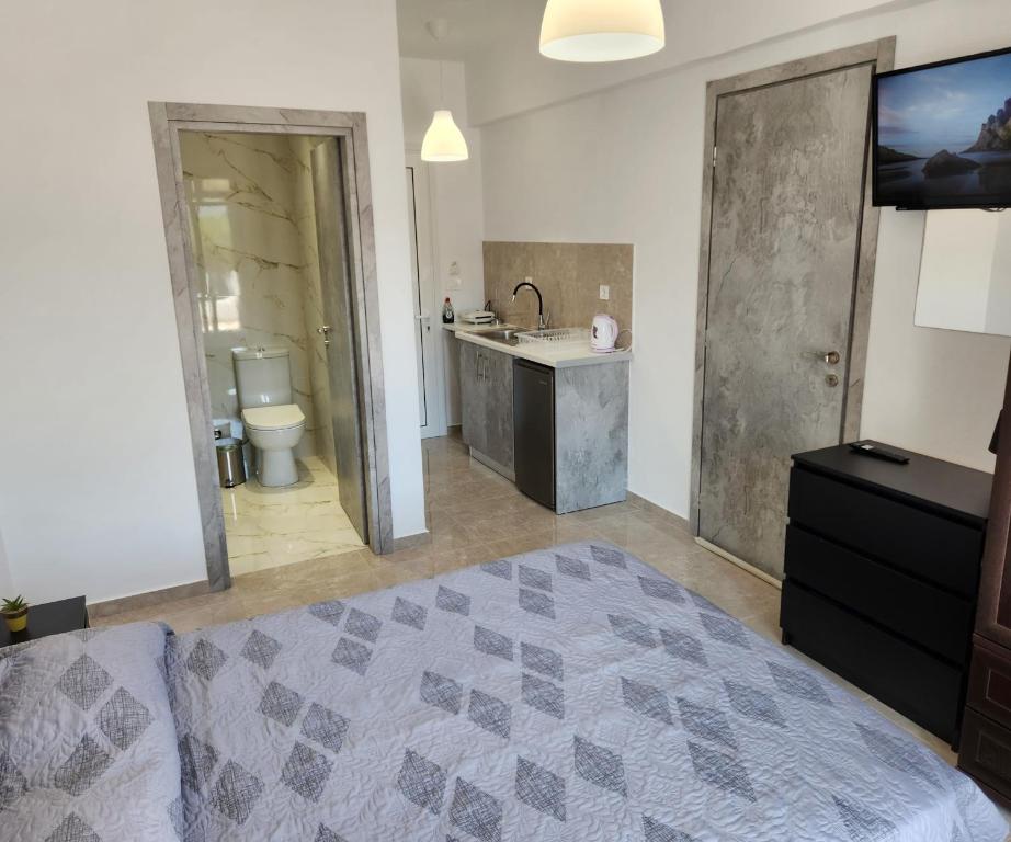 Postel nebo postele na pokoji v ubytování Kos Harmony Apartments