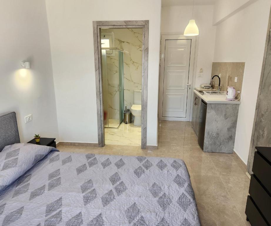 Postel nebo postele na pokoji v ubytování Kos Harmony Apartments