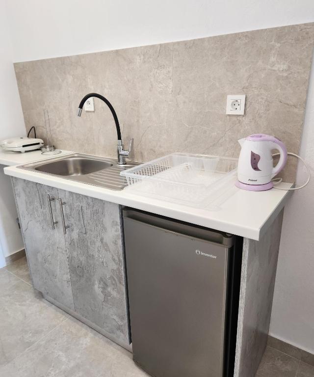 Kuchyň nebo kuchyňský kout v ubytování Kos Harmony Apartments