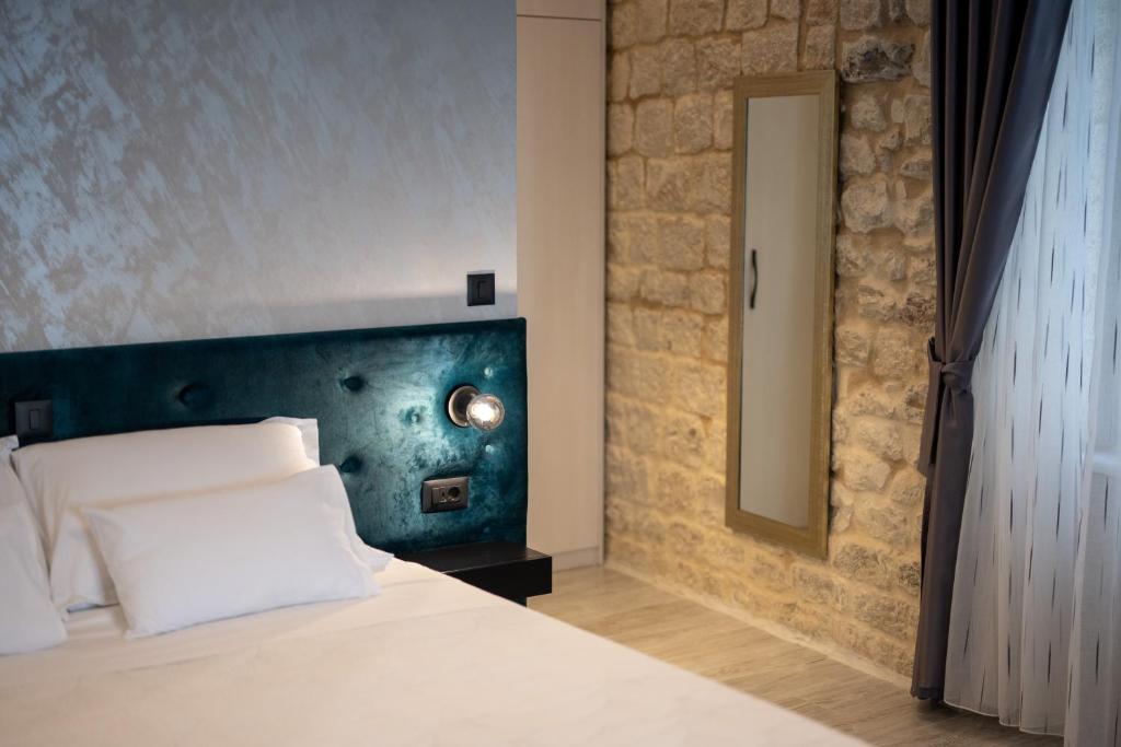 Posteľ alebo postele v izbe v ubytovaní Luxury Rooms "Kaleta"