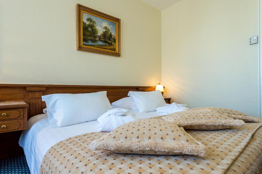 Postel nebo postele na pokoji v ubytování Hotel Century