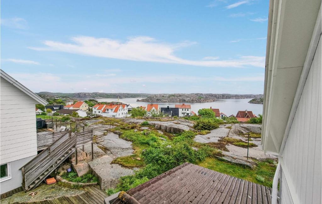 a view of the water from the balcony of a house at Awesome Apartment In Kungshamn With House Sea View in Kungshamn