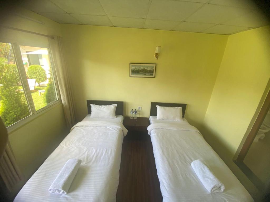 Postel nebo postele na pokoji v ubytování Ocean Inn