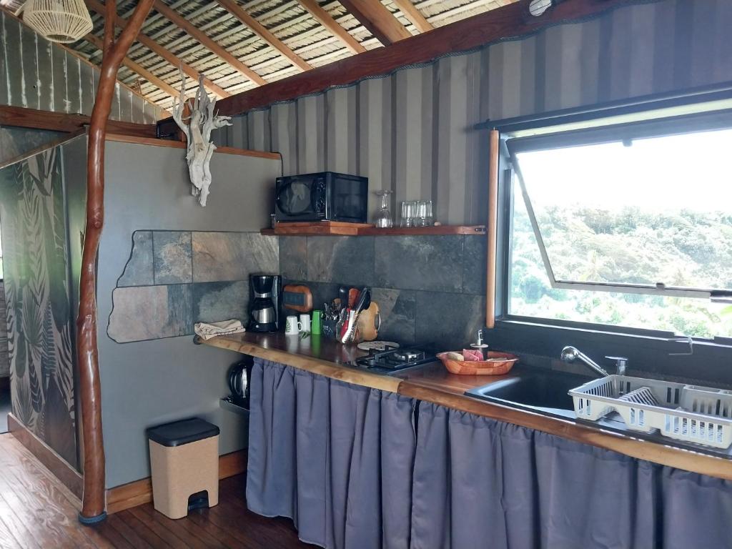 Kuchyň nebo kuchyňský kout v ubytování Faré Mahi Mahi