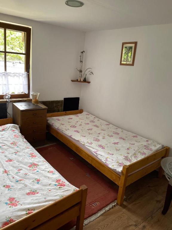 Posteľ alebo postele v izbe v ubytovaní Dom nad rzeką