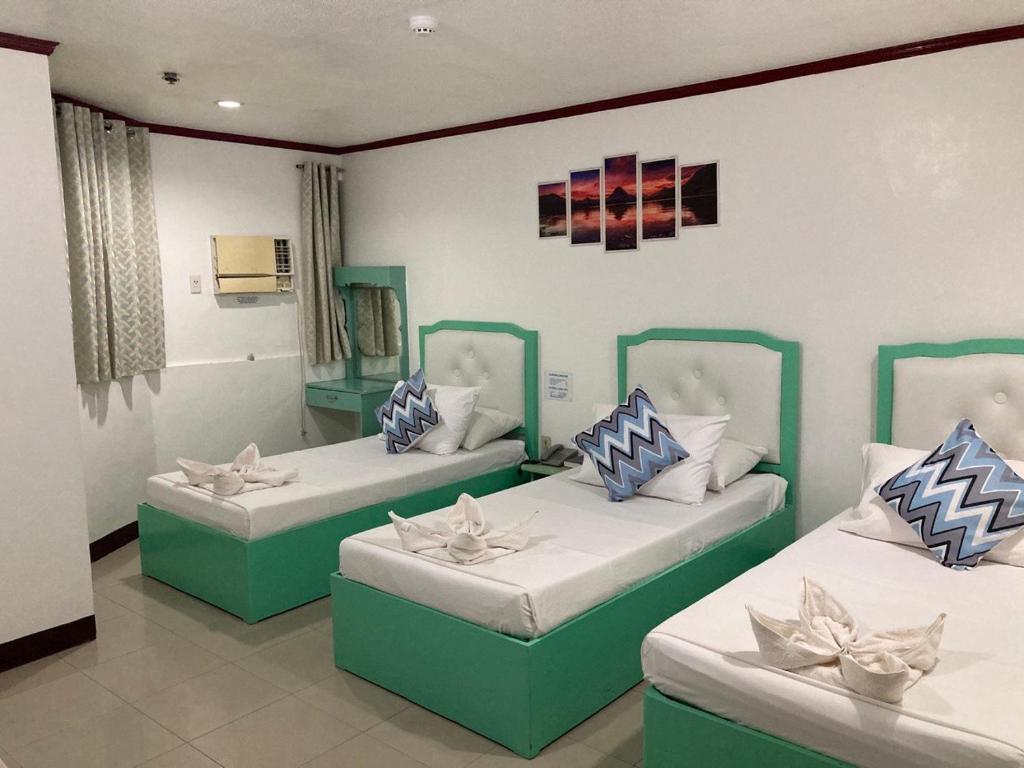 Postel nebo postele na pokoji v ubytování Demiren Hotel