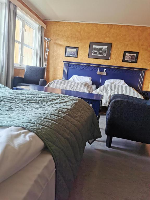 Postel nebo postele na pokoji v ubytování Grong Hotell