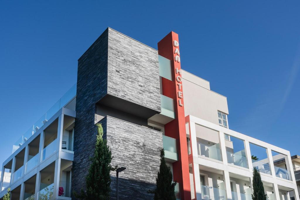 a rendering of a building with a red stripe on the side at Dan Hotel in Riccione