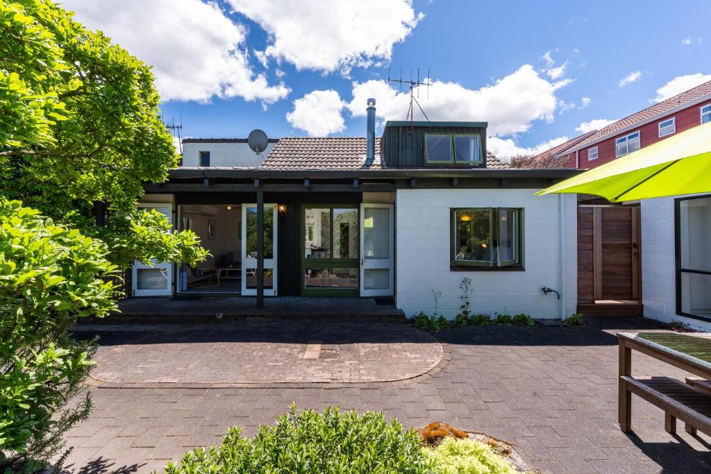 a house with a patio in front of it at Elegant Townhouse in Taupo