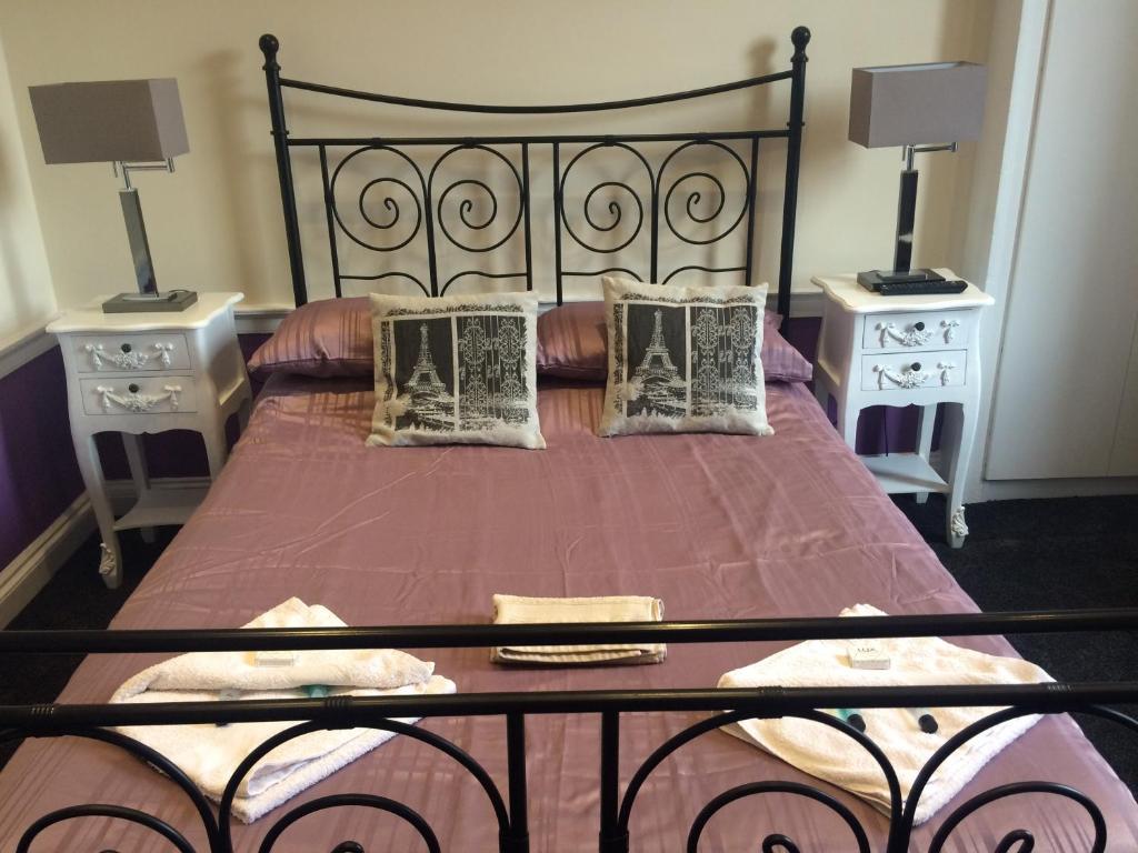 a bedroom with a large bed with two night stands at Adam Drysdale House in Edinburgh