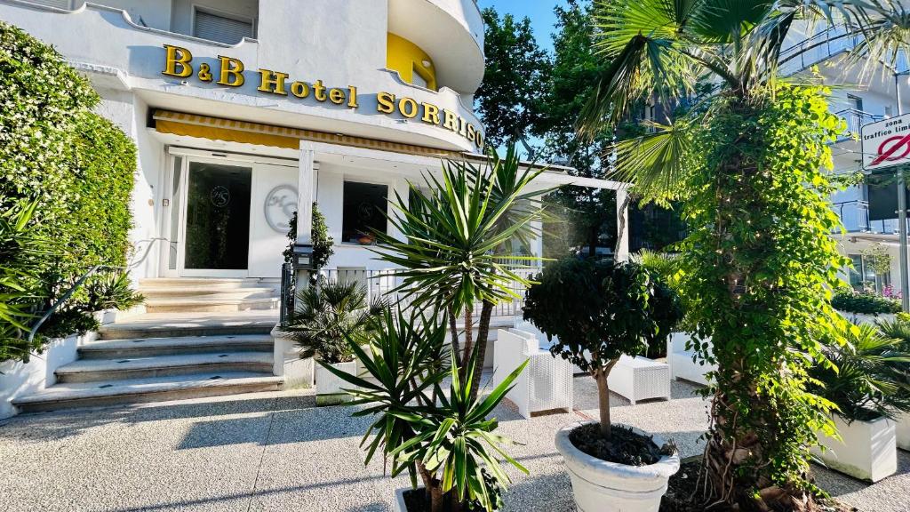 a hotel building with a sign that reads bbb hotel society at Hotel Sorriso in Cattolica