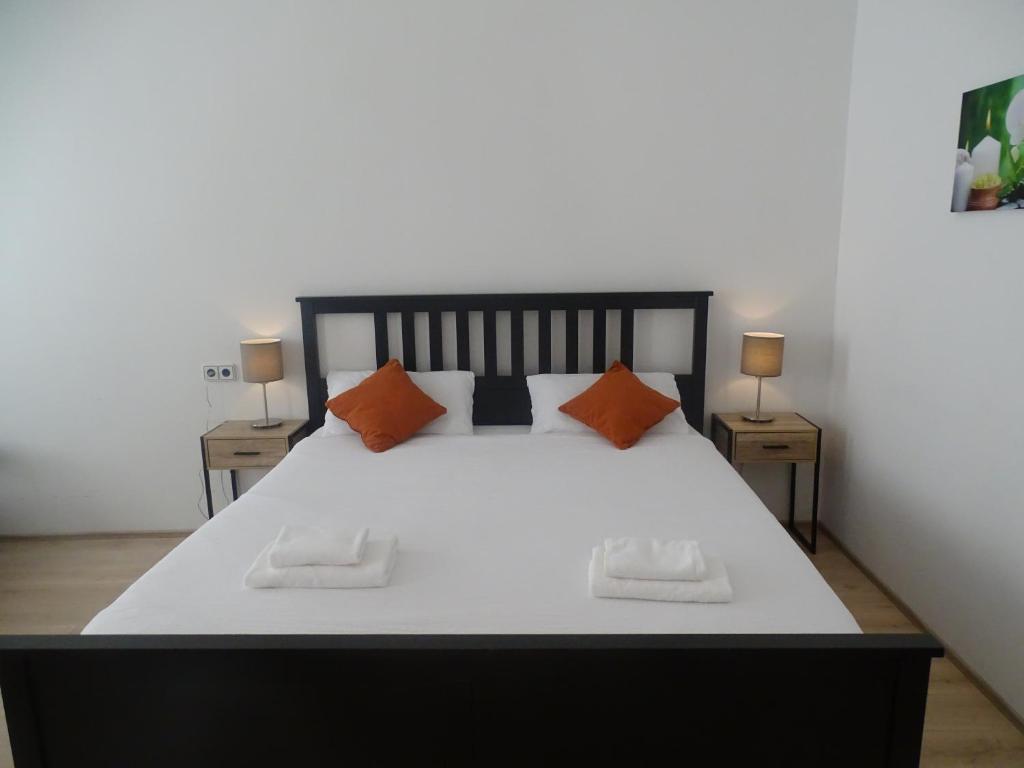 Postel nebo postele na pokoji v ubytování Centre Apartments