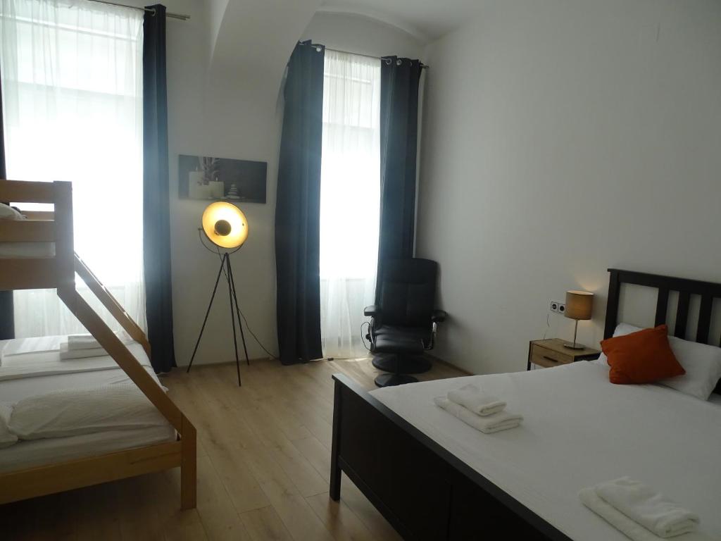 Postel nebo postele na pokoji v ubytování Centre Apartments