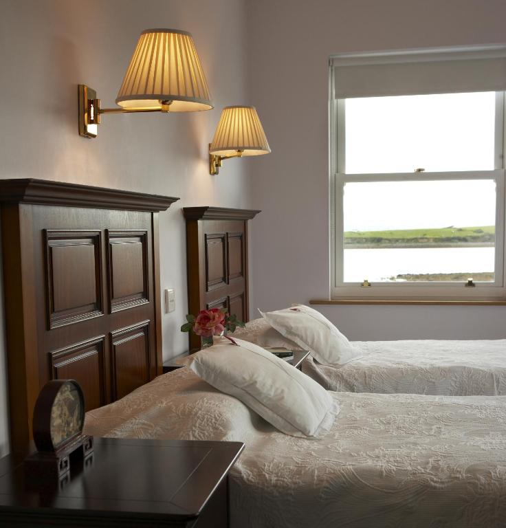 Postel nebo postele na pokoji v ubytování Seapoint House