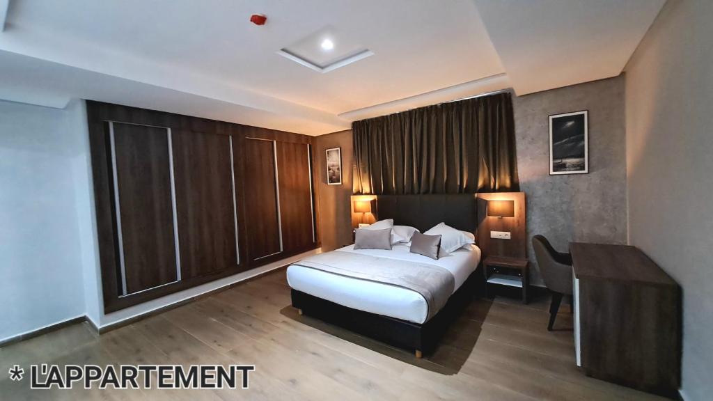 Postel nebo postele na pokoji v ubytování Hotel Jaouharat Ismaili