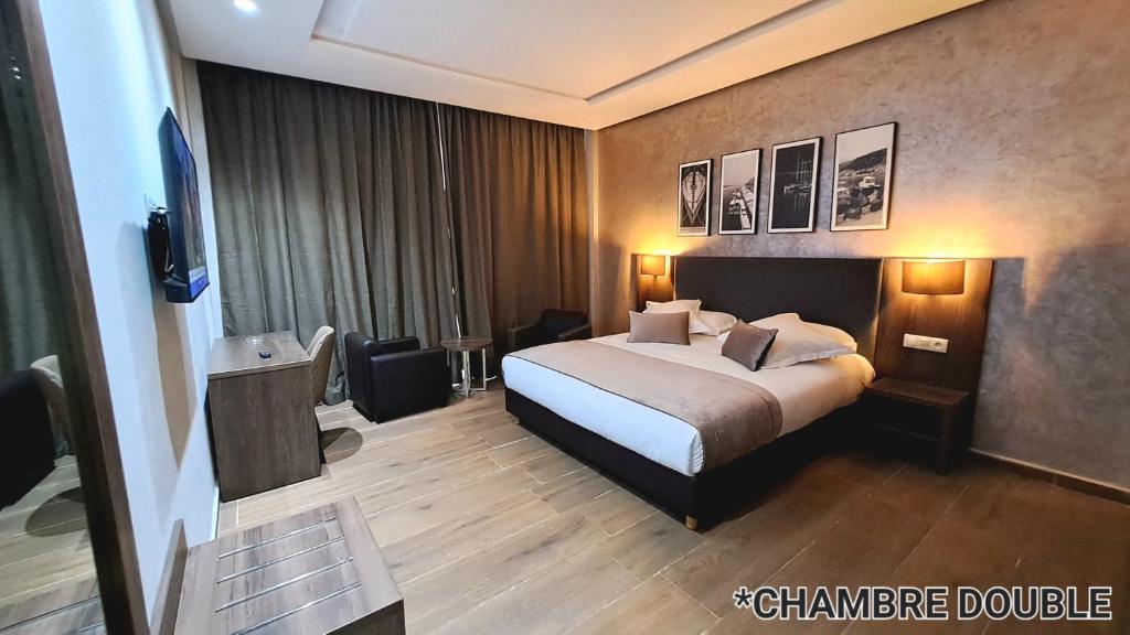 Postel nebo postele na pokoji v ubytování Hotel Jaouharat Ismaili