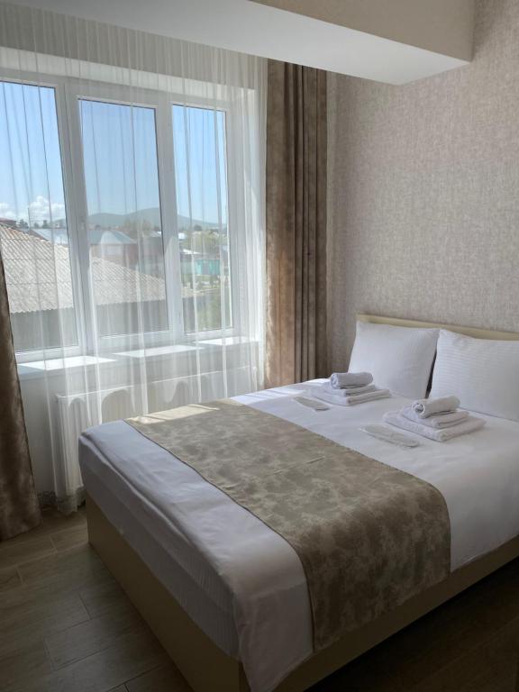 Postel nebo postele na pokoji v ubytování Hotel Sharl