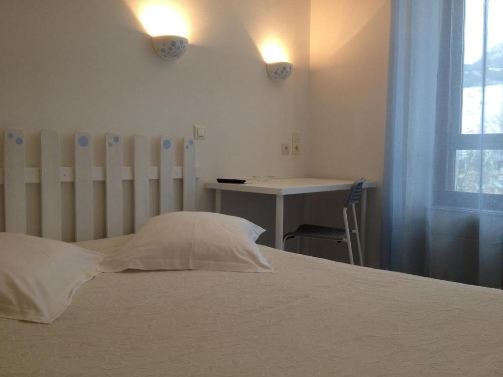 Postel nebo postele na pokoji v ubytování Au Nouvel Hôtel