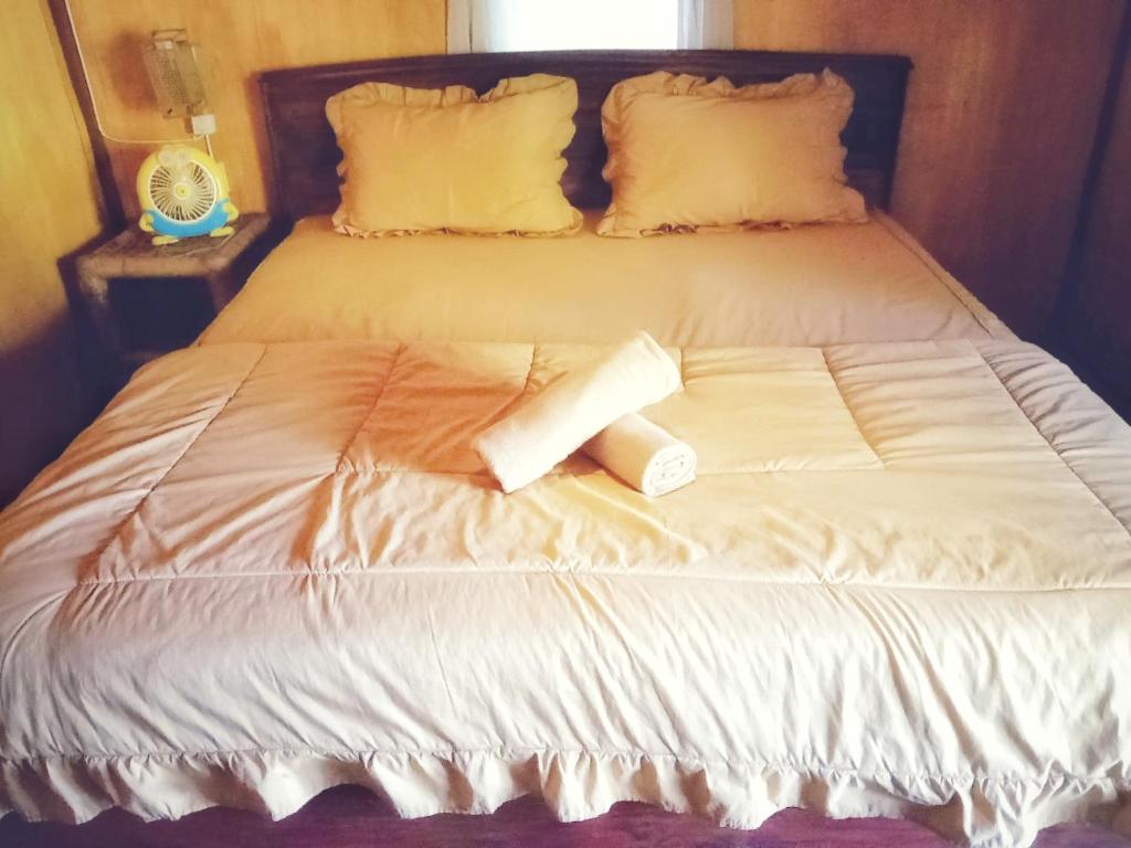 Voodi või voodid majutusasutuse Pondok rinjani bungalow tetebatu toas