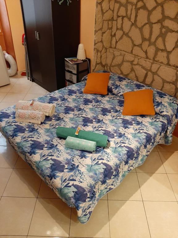 a bed with two pillows on top of it at Le Malte in Menton