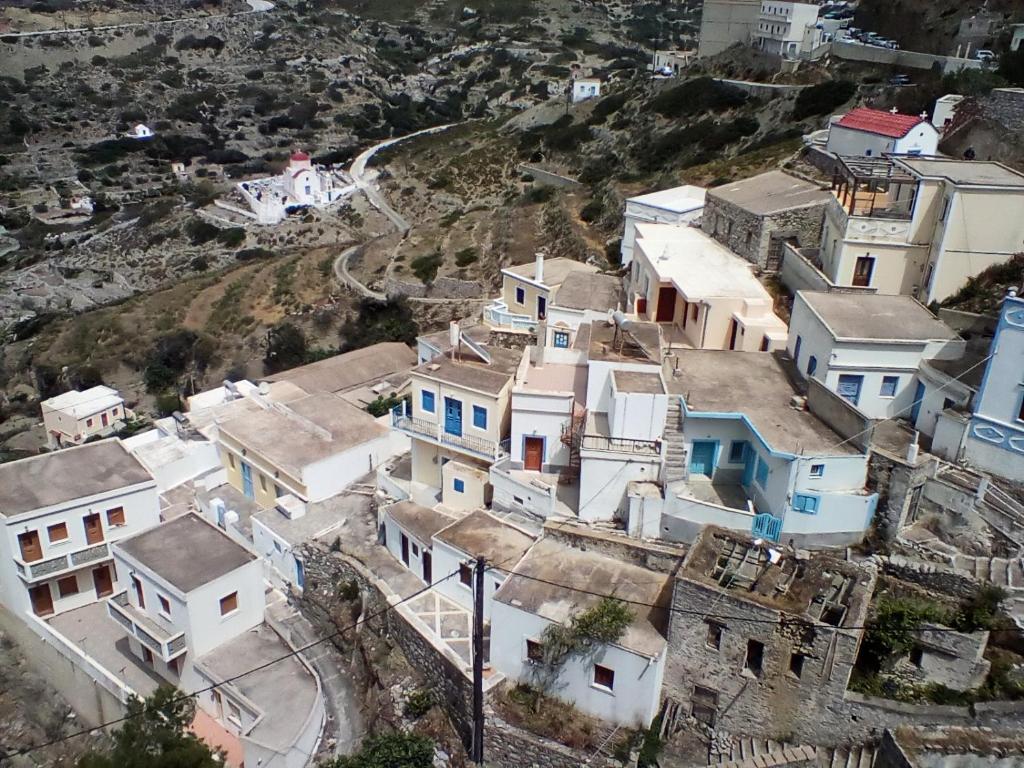 an aerial view of a village with houses at Olympos apt with amazing mountain view in Olympos