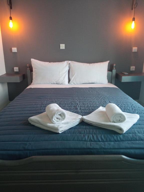 Postel nebo postele na pokoji v ubytování Hotel Theoxenia