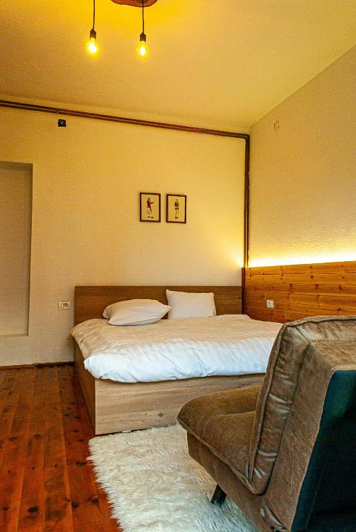 Een bed of bedden in een kamer bij N'konak Guesthouse